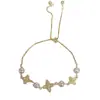 Pulsera de hilo con flor de cuatro hojas de circón y perla para mujer, exquisita, moderna, de lujo ligero, de alta gama, súper brillante, joyería versátil al por mayor