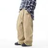 Pantalones de trabajo de mezclilla lavada estilo retro americano, unisex, con un diseño minimalista, corte holgado y estilo de pierna ancha