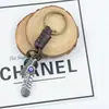 Chaveiro criativo masculino e feminino pequeno presente liga folha olhos vintage tecido couro chaveiro pingente de couro
