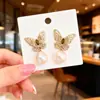 Aretes de Mariposa Calada con Diamantes y Perlas Color Café Dorado para Mujer 2025 Nuevos Aretes de Mariposa Estéreo de Alta Gama