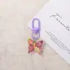 Llavero de mariposa de resina de colores dulces, colgante de hebilla de puerta, producto terminado creativo hecho a mano DIY, decoración de accesorio para bolso