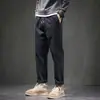 Pantalones casuales de rebaja para hombre rectos holgados marca de moda overol tipo harén otoño e invierno Nueva Moda pantalones largos deportivos