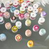 Acessórios de unhas de rosquinha colorida misturada Acessórios de unhas luminosas Comida fofa Jogar Desgaste infantil Acessórios de unhas misturados