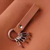 Llavero Colgante de Cuero para Hombres y Mujeres de Metal de Nicho Cubierta de Llave de Cobre Retro Cuerda Anillo de Llavero con Resorte Hebilla Colgante de Joyería