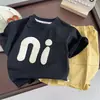 Ropa infantil de verano 2026, estilo nuevo, para niños y niñas, camiseta básica de algodón puro para niños, top infantil de talla grande, camiseta de marca moderna