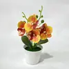 Orquídea artificial de alta gama, minimalista, en maceta, con cuatro flores en una maceta poco profunda, adecuada para la sala de estar, el recibidor o la decoración de escritorio.