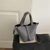 Bolsa de balde texturizada estilo ocidental 2026 versão coreana verão nova moda simples casual versátil bolsa de ombro transversal