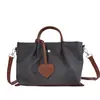 Bolso de hombro patchwork con bloques de color, popular bolso cruzado casual versátil estilo japonés para mujer, bolsa de mano ligera otoño 2026