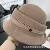 Nuevo Sombrero de Pescador de Hilo Tejido Hueco Plegable para Mujer de Primavera y Verano Protección Solar Sombrilla Elegante Adelgazante de Rostro