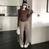Calça de tricô com fenda lateral, design de senso de estilo preguiçoso, feminina, outono, tricô macio e fofo, cintura alta, caimento, perna reta casual, comprimento até o chão