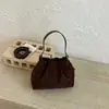 Bolso de hombro retro de ante para mujer, nuevo bolso de mano de estilo coreano de nicho de moda 2026, elegante bolso cruzado tipo cubo