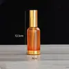 Botellas de Aceite Esencial Base Dorada al por Mayor en Stock con Spray de Presión, Botellas para Cuidado de la Piel con Gotero de Punta de Goma, Botellas Vacías para Dispensar Líquidos