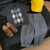 Estilo Coreano Niños Verano 2026 Nuevo Patrón de Diamantes Grises Cuello Polo Manga Corta Tejido Traje Casual para Niños Pantalones