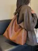 Bolso Mujer 2026 Nuevo Estilo Bolso para el Trabajo y el Viaje Sensación de Alta Gama Bolso Tejido para el Hombro Bolso de Hombro Retro de Moda Transfronterizo