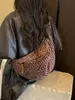 Bolso súper popular de nicho con estampado de leopardo para mujer, nuevo bolso cruzado de moda versátil 2026, exquisito mini bolso de cuerno, bolso tipo empanada