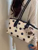 Bolso grande de mano popular para mujer 2026 versión coreana moda moderno bolso de hombro elegante para el día a día bolso tote de lunares moderno