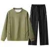 Otoño/Invierno 2026 Nuevo Sudadera con Capucha Casual Holgada de Manga Larga y Pantalones Largos Estilo Americano Trendy con Diseño de Remaches Cuello Redondo Marca Trendy Tridimensional