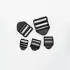 Suministro directo de fábrica hebilla plana de plástico de cuatro dientes hebilla curva hebilla trapezoidal hebilla ajustable para mochila hebilla para mochila