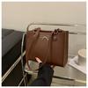 Este ano, a popular bolsa tote de ombro axila com logotipo de borboleta de cor sólida 2024, moda retrô, casual, simples e portátil
