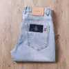 Jeans rectos ajustados de mezclilla finos, ligeros, azul claro, elásticos, suaves, de cintura media, a la moda, combinan con todo, bordados para hombre, primavera/verano 2023