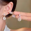 Pendientes de perlas de nicho de lujo con luz de aguja de plata S925, de alta calidad, versátiles, elegantes y exquisitos, con lazo incrustado de diamantes.