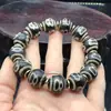 Venta al por mayor del fabricante Pulsera de cuentas Dzi de Xizang 16 mm Negra y Blanca Dzi Weathered B