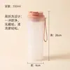 Botella de agua de alta apariencia para niñas, antibacteriana con iones de plata, hecha de PP, con asa, portátil, a prueba de fugas, para beber directamente con un solo clic, fácil de limpiar