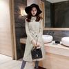 Leche de papaya ropa de invierno nueva moda elegante europea y americana cuello alto longitud media lana con cinturón adelgazante abrigo para mujeres a la moda