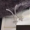 Novos Brincos de Tarraxa Estrela de Quatro Pontas com Strass Completo Zircônia para Mulheres Design de Nicho Versátil de Alta Qualidade Exquisite Brinco de Lua Crescente para Mulheres