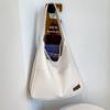 Bolso pequeño textil de otoño e invierno 2024, nuevo bolso informal de color liso para mujer, popular bolso de hombro retro de gran capacidad.