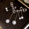 Brincos de Tarraxa Super Fada com Franjas Laço Pérolas Doce Temperamento Fashionable Leve Luxo Toque de Alto Padrão Brincos de Tarraxa Europeus e Americanos Atacado