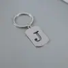 Venta Caliente de Productos Nuevos Transfronterizos 26 Letras Inglesas Huecas de Acero de Titanio Sin Decoloración Accesorios de Joyería Llavero 26 Letras