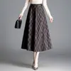Falda de moda a cuadros para otoño e invierno, elegante falda de línea A de cintura alta para mujer, falda holgada y fluida de longitud media, nueva 2026