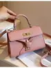 Bolsa de mujer de venta caliente transfronteriza otoño 2026 nuevo súper popular nicho platino bolso Kelly versátil bolso de hombro y bandolera