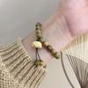 Estilo cool pulseira de contas redondas de sândalo verde retrô com círculo único de Lótus feminina nicho Wenwan Buda casal mão de madeira