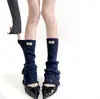 Nuevo producto de otoño e invierno: puños de calcetín rotos con etiquetas de tela, ligeramente acampanados, adelgazantes, calcetines de pantorrilla apilados, calentadores de piernas versátiles para mujer