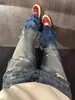 Jeans rasgados lavados con efecto rayo azul claro para hombre, pantalones con vibra de la alta calle americana, pantalones de corte recto y ajuste limpio