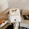 Mochila com Laço Doce para Meninas e Mulheres 2026 Nova Moda Texturizada Mochila Escolar para Estudantes Mochila Pequena Diária