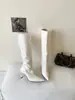 Botas altas de tacón alto puntiagudas adelgazantes de charol versátiles estilo europeo y americano