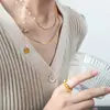 Collar de perlas de diseño de nicho de personalidad simple de alto grado de nuevo estilo francés, colgante de acero de titanio, cadena para la clavícula, joyería versátil