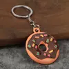 Chaveiro de rosquinha realista, pingente de sobremesa em liga metálica com gotas de óleo, chaveiro fofo para bolsa, pequeno presente, disponível para atacado