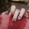 Set de 10 Piezas de Uñas Postizas Premium Hechas a Mano con un Look Sofisticado, Presentando Moños 3D, Cadenas de Pedrería y Diseño Ojo de Gato