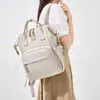 Nueva mochila de moda transfronteriza para mamás con gran capacidad, resistente al agua, separación de húmedo y seco, almacenamiento simple para madres y bebés