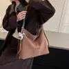 Bolso tote texturizado vintage de alta gama para mujer, nuevo modelo 2026, bolso de hombro casual simple, mochila versátil y elegante