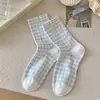 Calcetines de algodón antibacterianos para mujer de primavera y verano, longitud media hasta la pantorrilla, nuevo estilo 2026, calcetines blancos holgados populares para mujer
