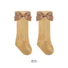 Nuevos calcetines altos para primavera/verano 2026 para bebés niñas, calcetines largos de princesa de malla fina hueca con lazo para niñas
