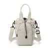 Mochila para Axila de Mujer, Bolso Casual Versátil para Viaje de Dama, Nuevo Bolso de Hombro Portátil de Tela de Nylon 2026