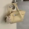 Bolsa Única com Textura Pequena Tote Bag para Mulheres 2026 Estilo Novo da Primavera Bolsa de Cesta Simples Ombro Transversal Bolsa Asa
