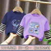 Camiseta de manga larga de algodón puro con retazos para niños, nuevo estilo primavera/otoño, diseño de dibujos animados, casual y versátil, parece un conjunto de dos piezas, moderno