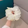 Goma para el pelo de encaje de malla floral de nicho estilo coreano 2026 Banda elástica para el pelo de alta gama de principios de primavera Cuerda para el pelo Nueva